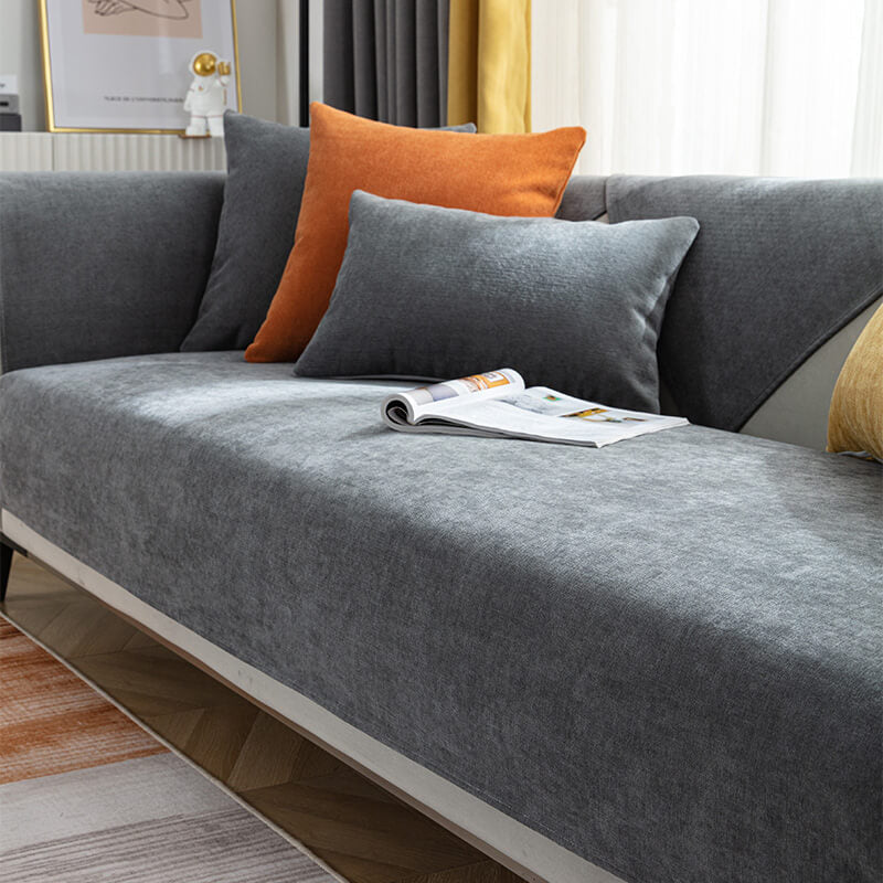 Contemporary living room featuring a comfortable sofa with a gray chenille slipcover