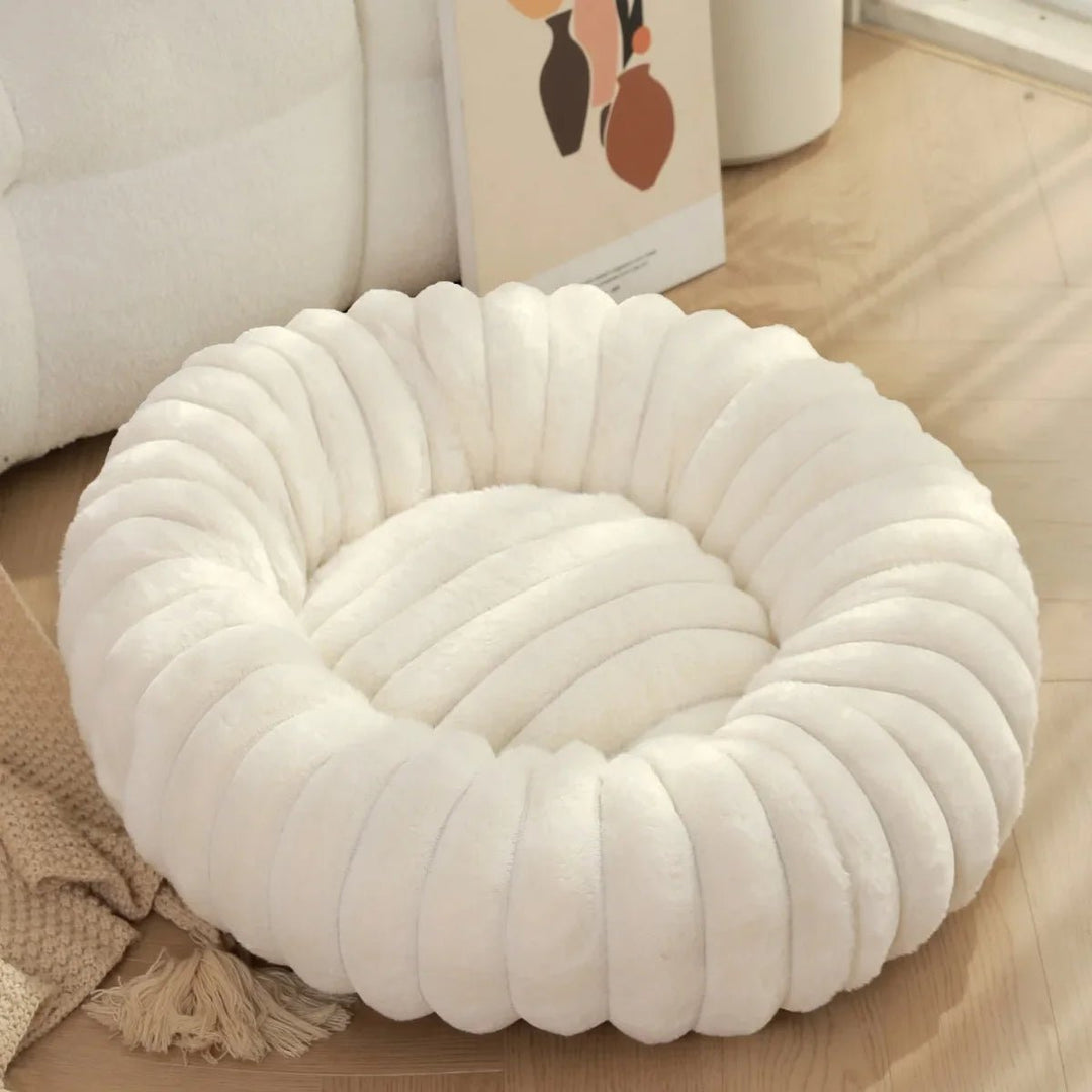Warm and cozy pet bed, a donut-shaped design offering superior comfort for small pets.