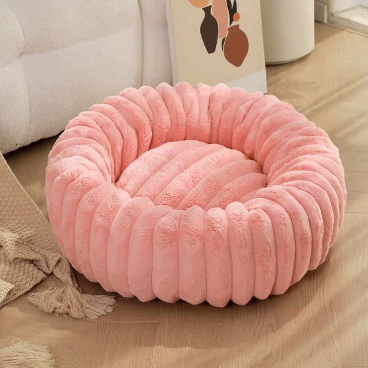 Luxurious plush donut pet bed, an essential calming solution for small and medium pets.