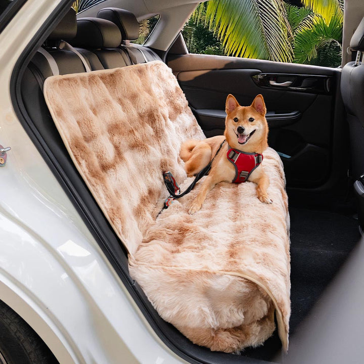 Detail shot of the faux fur texture of a pet car seat cover, highlighting its luxurious feel.