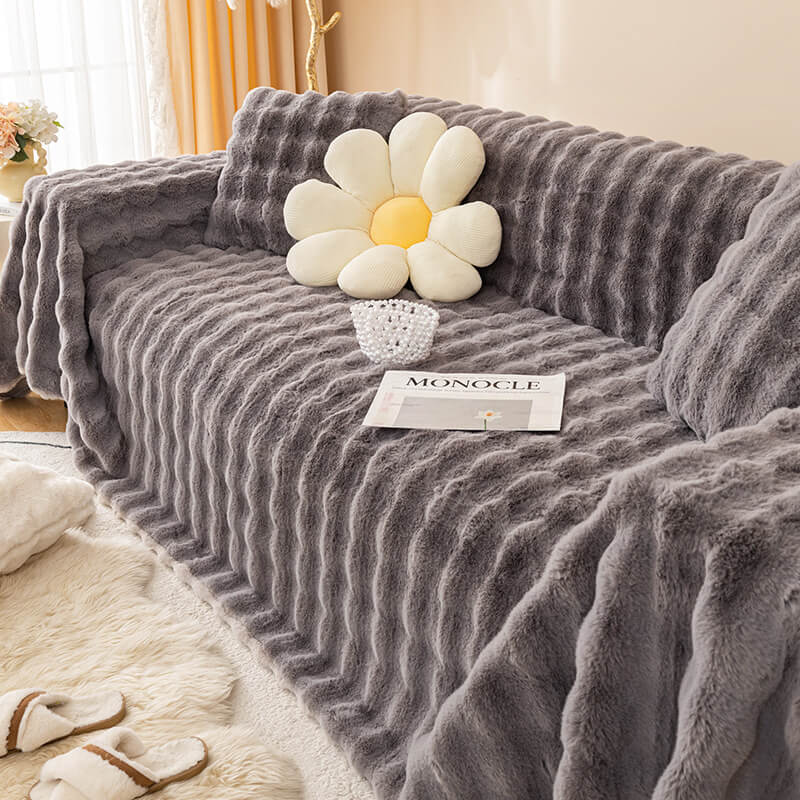 Plush faux rabbit fur sofa cover, a skin-friendly and pet-friendly couch protector in a living room setting.