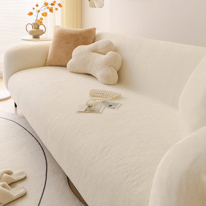 Plush full coverage sofa slipcover in a neutral color, ultra-soft and skin-friendly for furniture protection.
