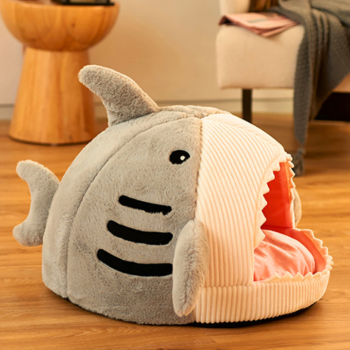 Close-up of the plush interior of a shark cave cat bed with a comfy pet cushion