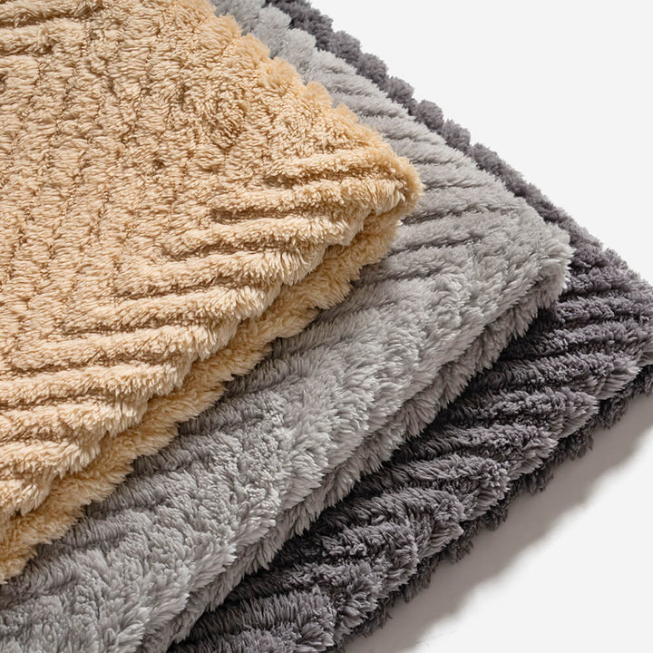 Detail of the woven plush herringbone pattern on a durable cushion cover for sofas
