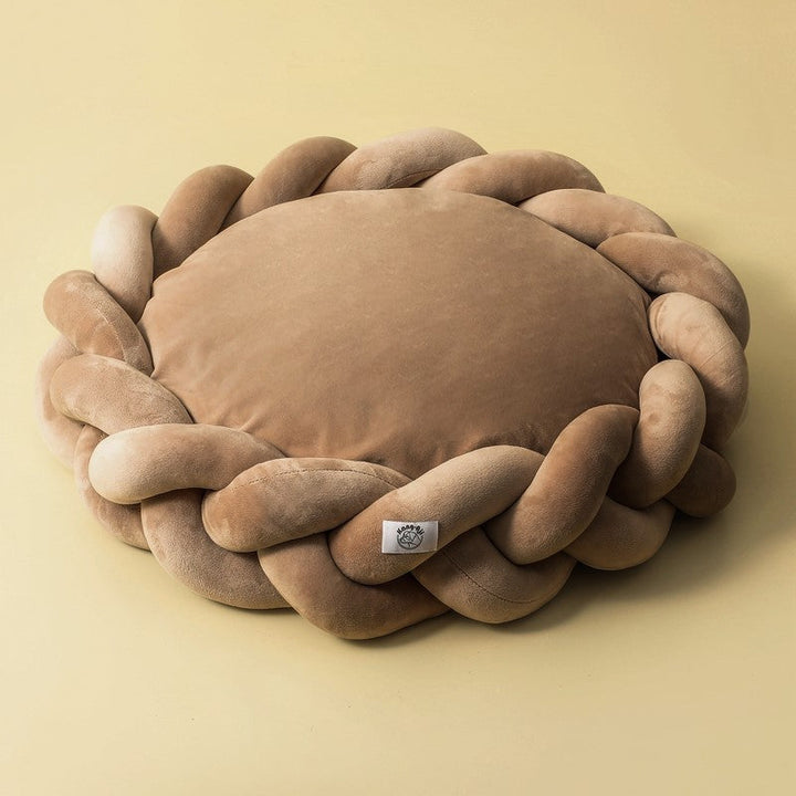 All breeds love this comfortable, machine washable plush dog bed with braided edges.