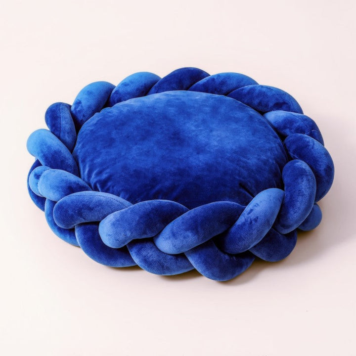 Premium quality dog bed: plush, comfortable, and featuring durable braided edges.