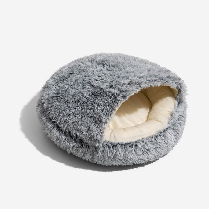 Side profile of the cozy pet nest bed, emphasizing the enclosed design for a secure dog sleep.