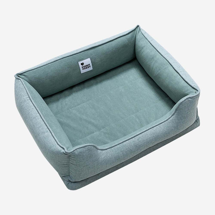 Small dog bed, square and plush, made from soft velvet for pet comfort.