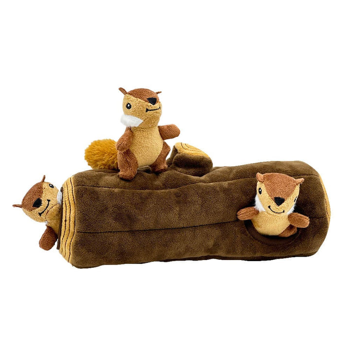 A dog's paw reaching for a squeaky squirrel plush hidden inside its interactive tree trunk toy