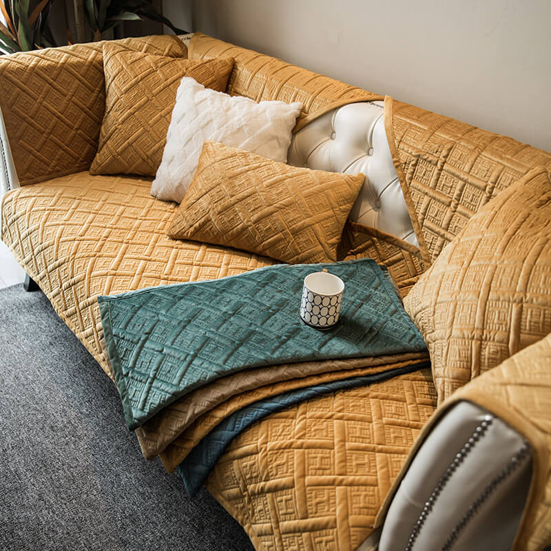 Pet-friendly velvet sofa protector, illustrating how it covers the entire couch for maximum protection.