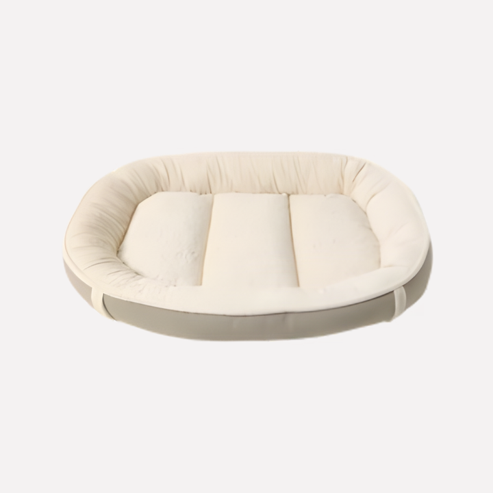 Close-up of a washable dog bed showing its plush texture and elevated edges, ideal for a cozy pet sleep.