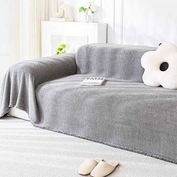 Packaging for a plush water-resistant furniture sofa protector, highlighting easy clean features.