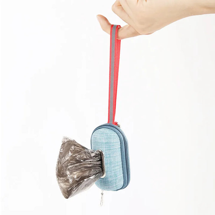 Compact dog waste bag dispenser attached to a leash, a must-have dog accessory for pet owners.