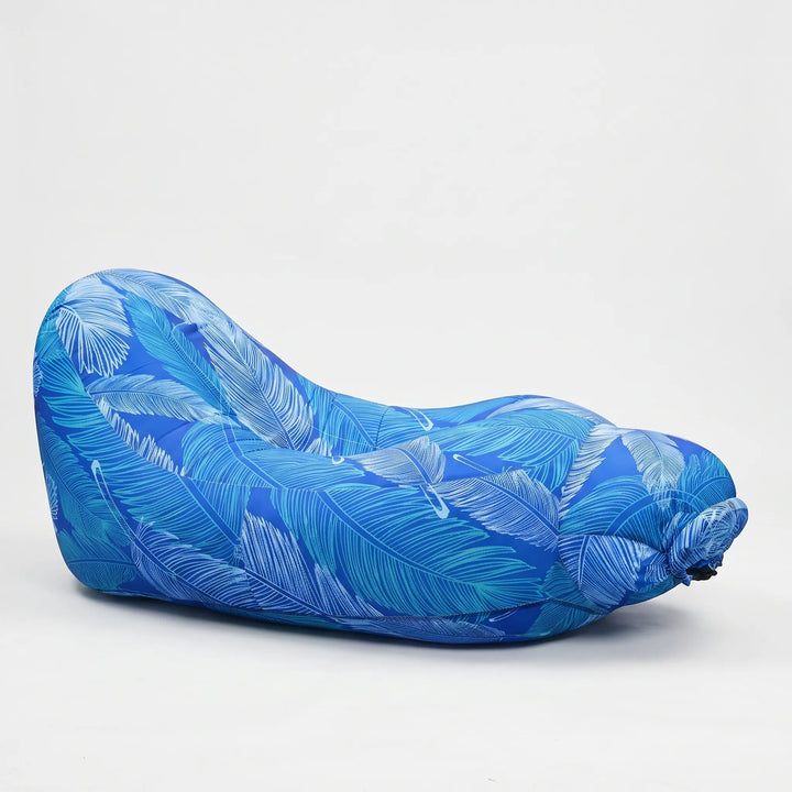 Inflatable beach lounger for sunbathing by the pool. Comfy outdoor seating, perfect for relaxation & travel.