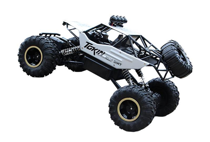 "RC-Monstertruck 4x4 in Aktion, robustes Design, stoßfeste Federung und Allradantrieb auf unwegsamem Gelände."