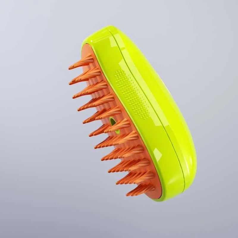 Pet grooming steam brush with ergonomic design, ideal for cat care and dog care fur removal.