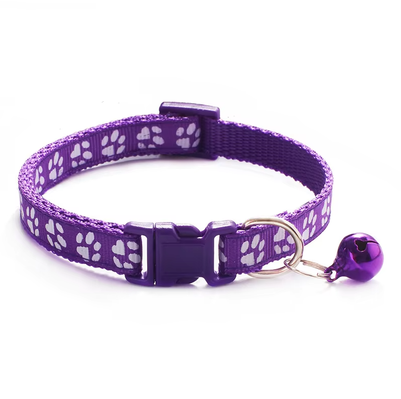 Yellow cat safety collar with bell and paw print design, adjustable strap