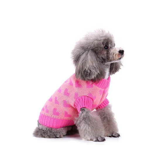 Front view of a red dog sweater with a vibrant white snowflake design
