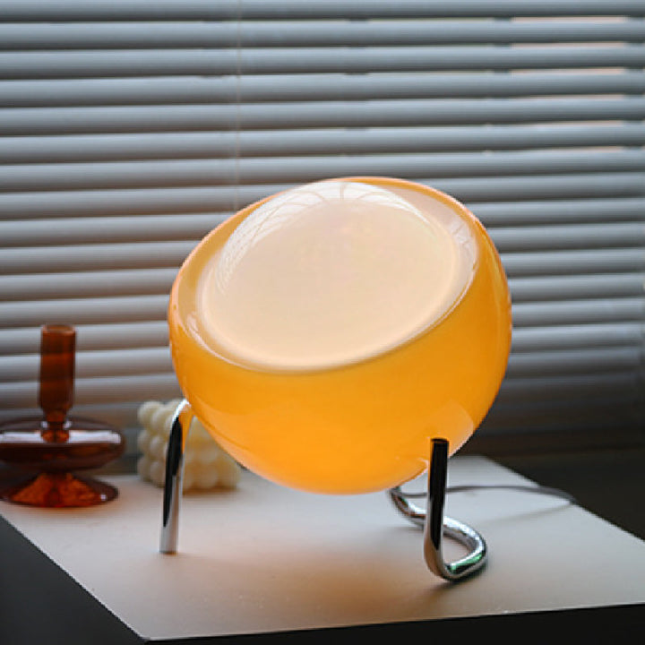 Elegant glass orb lamp with retro Nordic design. Ambient LED light, perfect table accent for modern classic home decor.