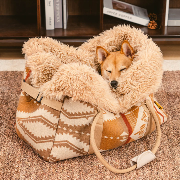 Reversible pet carrier and dog snuggle bed in indie boho pattern, portable travel accessory for cats and dogs.