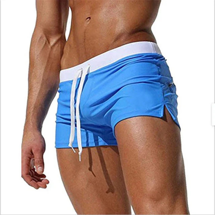 "Schnelltrocknende Herren Badeshorts mit Kordelzug, wasserdicht, blau, ideal für Strand- und Wasseraktivitäten."