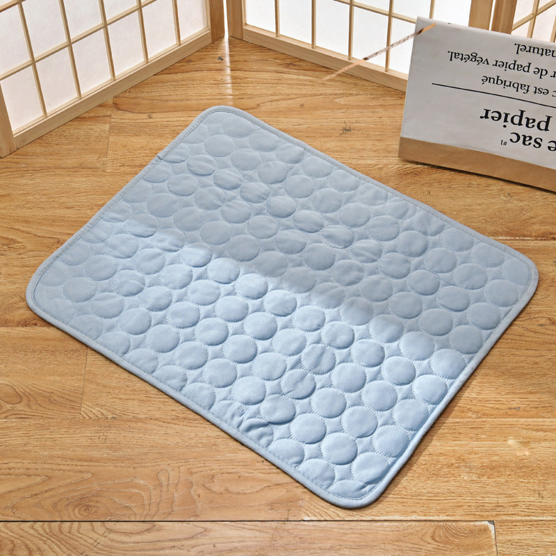 Happy pet lying on an easy-to-clean self-cooling mat, suitable for indoor outdoor use