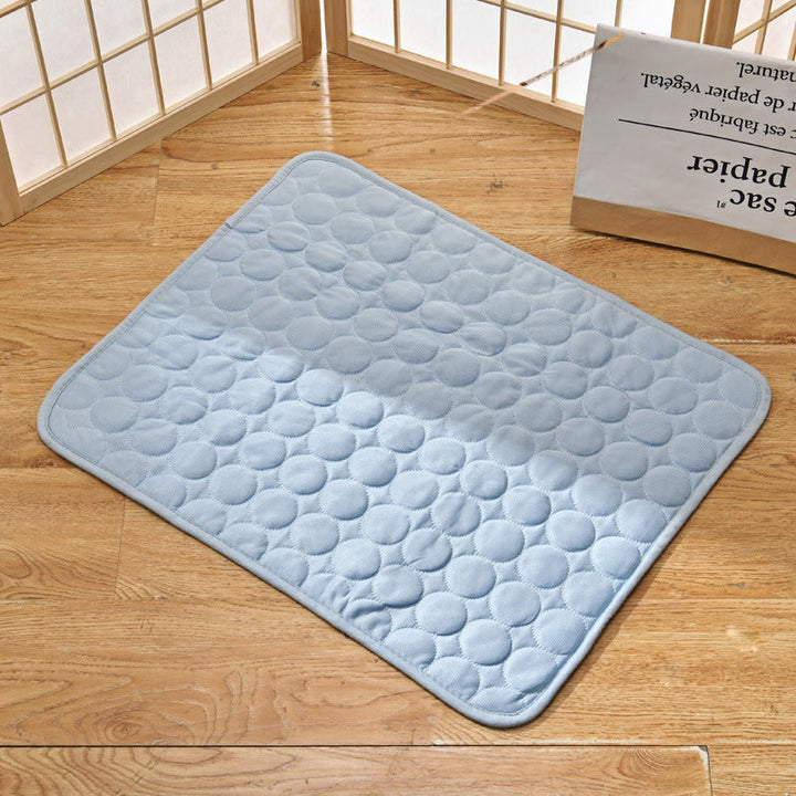 Happy pet lying on an easy-to-clean self-cooling mat, suitable for indoor outdoor use