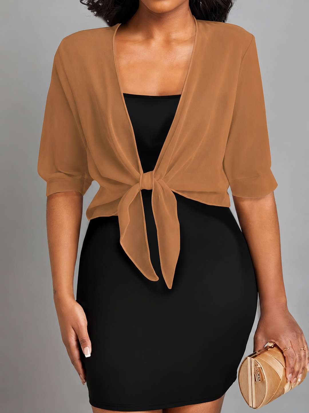 Casual chic women's sheer cropped bolero. Tie-front, half-sleeve top for versatile and stylish layering.