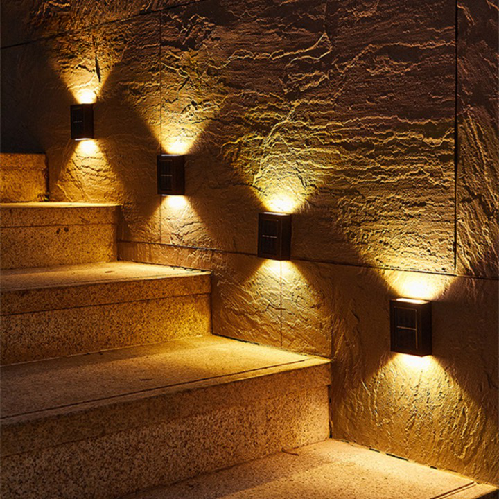 Sleek outdoor wireless solar LED wall light for garden and patio security. Energy-efficient exterior lighting.
