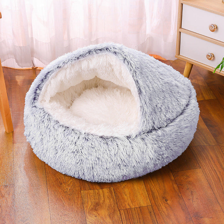 Small dog burrowing into a cozy, self-warming faux fur half-cave pet bed, ideal for anxiety relief.