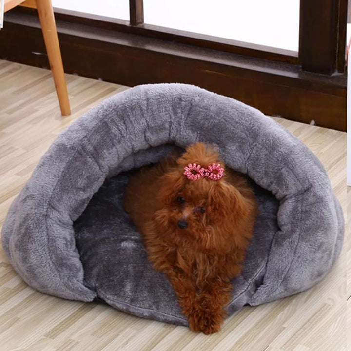 Portable faux fur dog cave bed designed for small dogs, offering a snug and calming retreat.