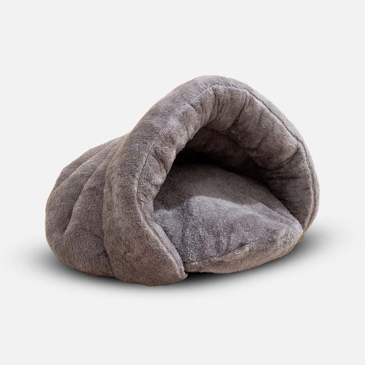 Cozy pet bed: a faux fur small dog cave bed, ideal for anxiety relief and peaceful sleep.