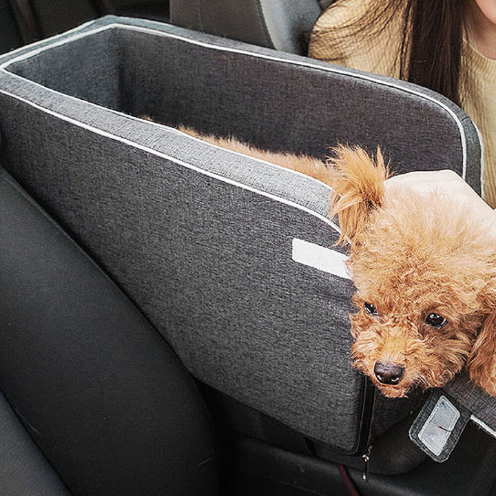 Grey suede pet car seat with safety straps, a secure and comfortable travel solution for small dogs.