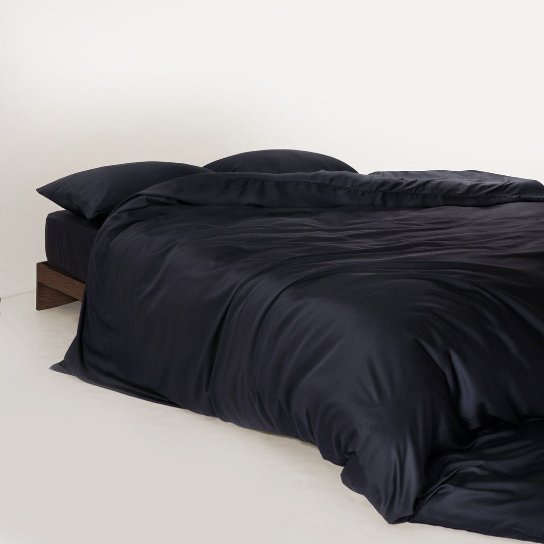 Stack of folded bamboo sheets and pillowcases, showing soft texture and quality