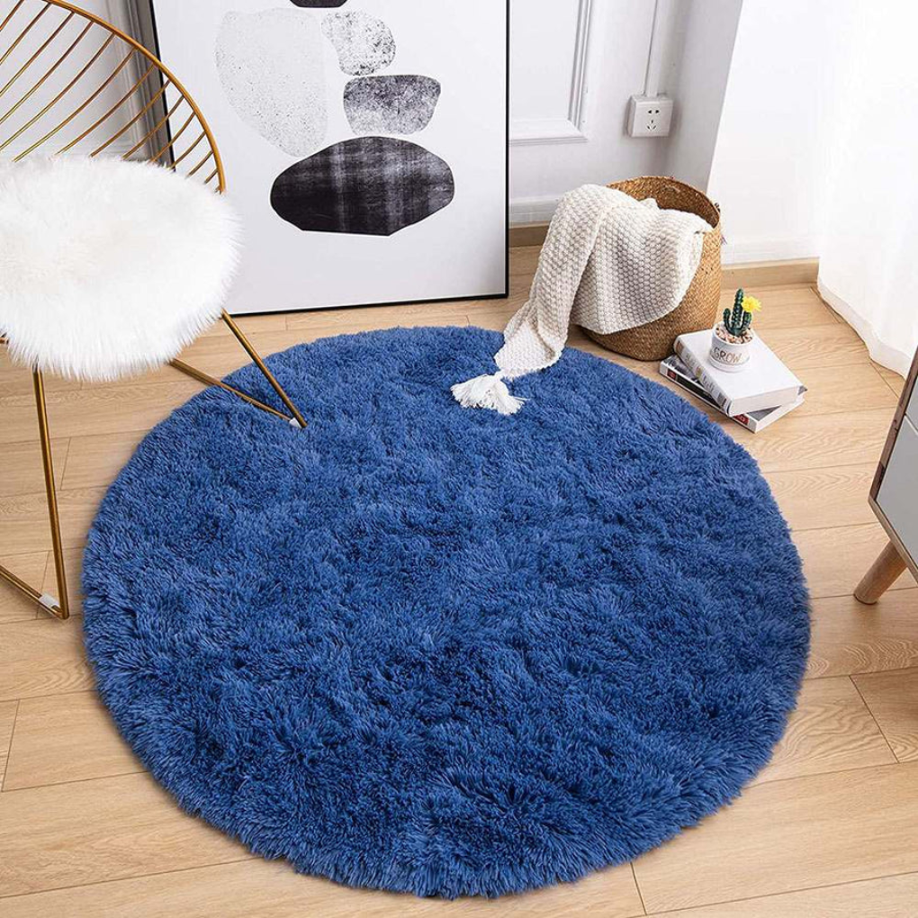Stylish round shaggy area rug, dense faux fur pile ideal for cozy home decor.