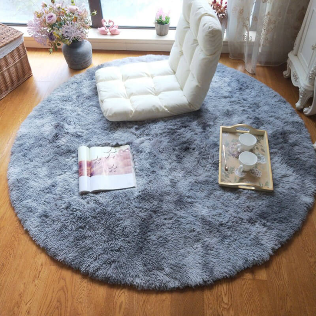 Elegant fluffy round area rug in a light cream color, plush feel for modern homes.