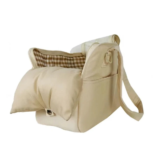 Soft-sided pet carrier with a small dog inside, demonstrating the safety harness and ample space