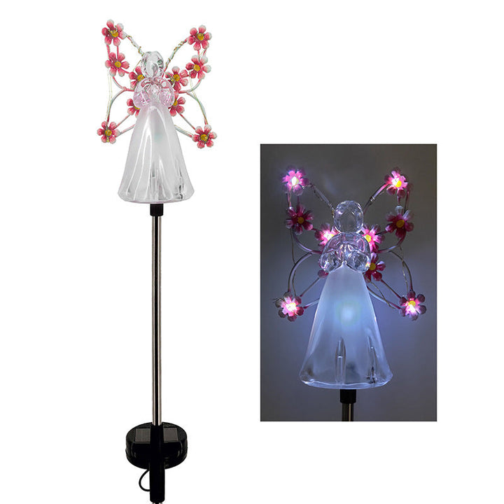Two solar angel garden stake lights, glowing softly, enhancing outdoor living areas and garden landscapes.