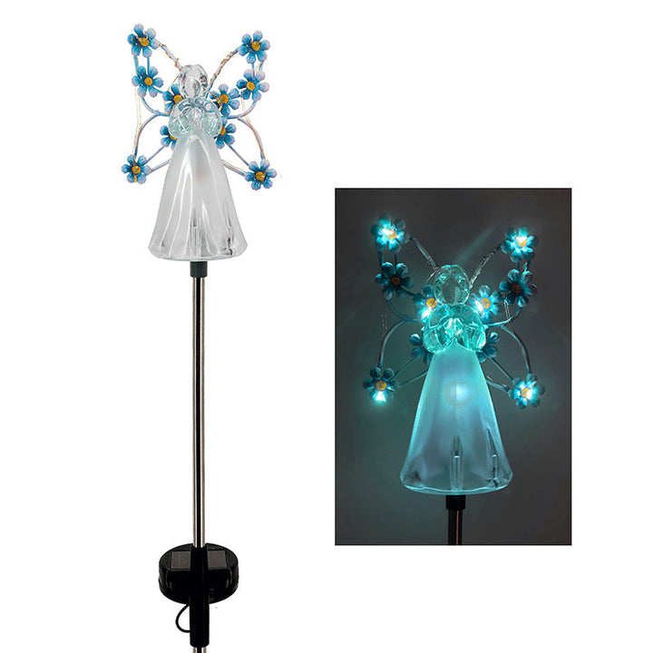 Close-up of a solar angel garden light, highlighting its detailed design and solar panel for outdoor decor.