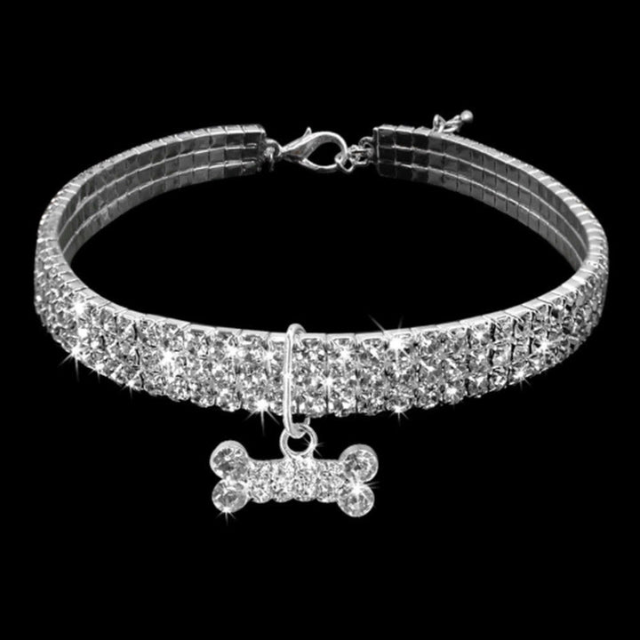 Pet accessory: luxurious dog collar with embedded rhinestones and a cute bone charm, adjustable fit.