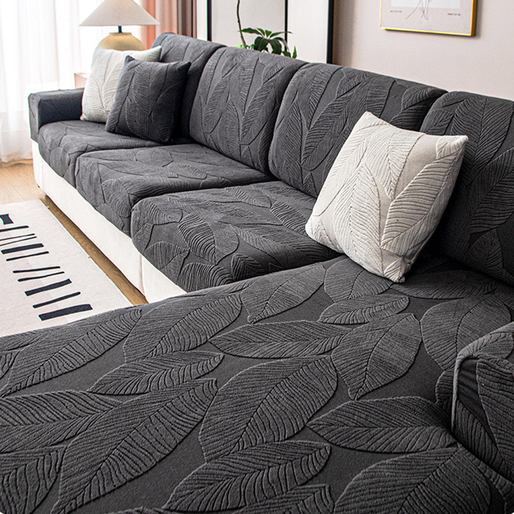 Stylish leaf pattern stretch sofa slipcover, a machine washable and waterproof furniture protector.