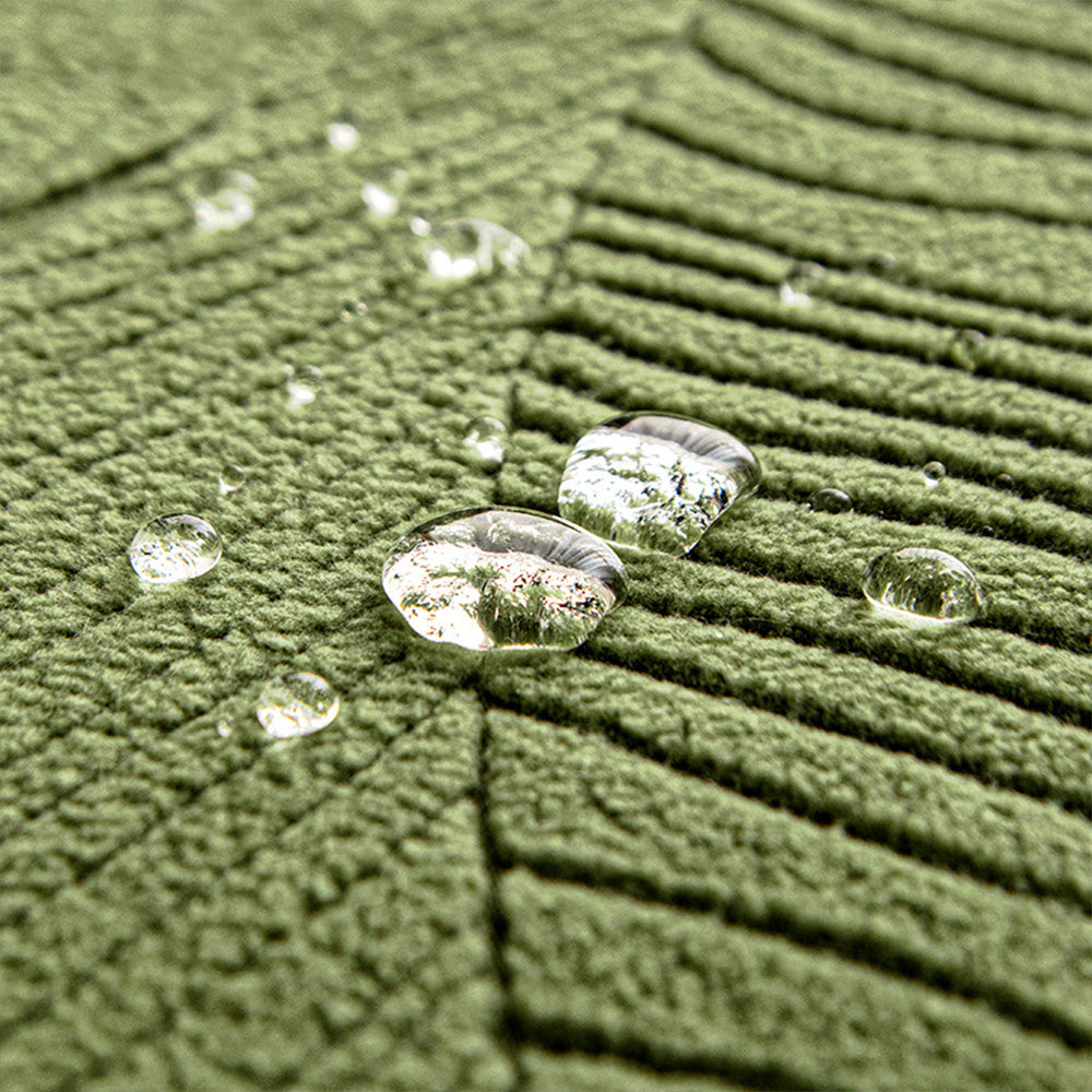 Close-up of jacquard leaf design on a durable, pet-friendly universal sofa cover.