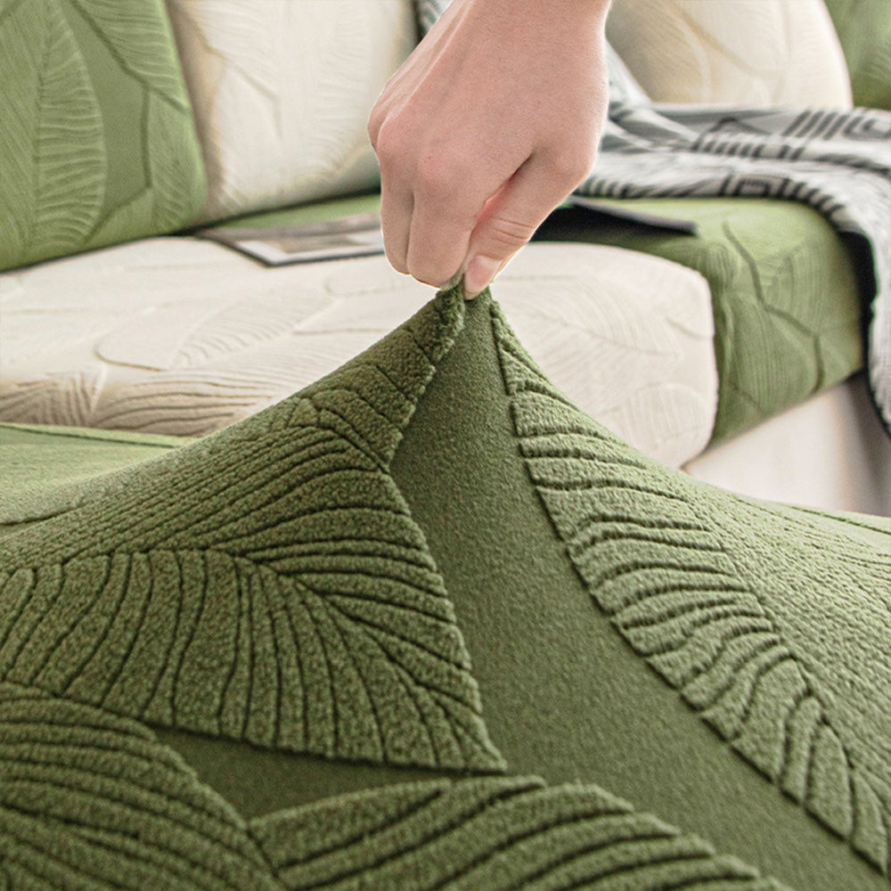 Machine washable stretch sofa slipcover with decorative leaf motif, ideal for busy homes.