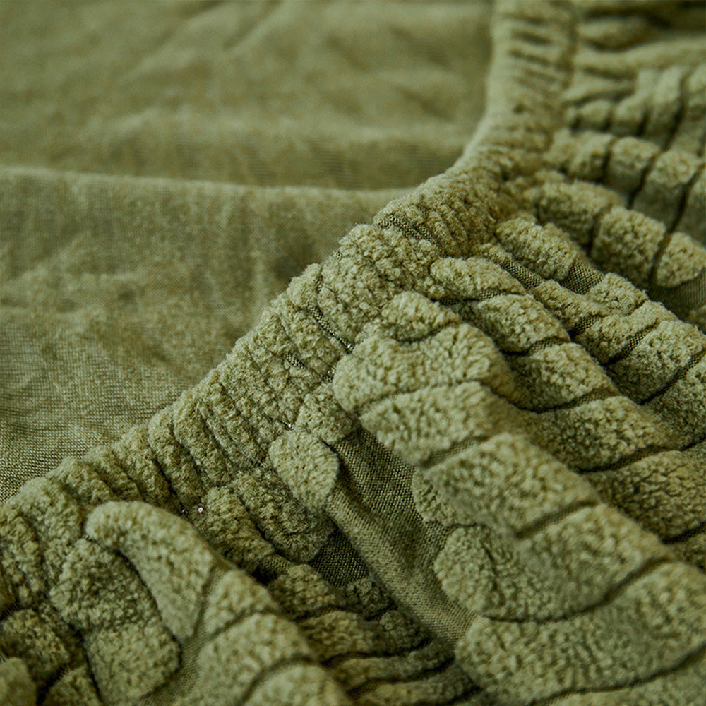 Flexible stretch sofa cover showcasing a beautiful leaf design, enhancing any home decor.