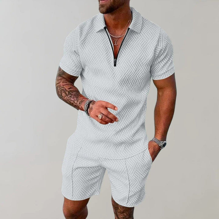 Comfortable men's two-piece short set with a stylish zip polo shirt. Ideal casual outfit for summer fashion.