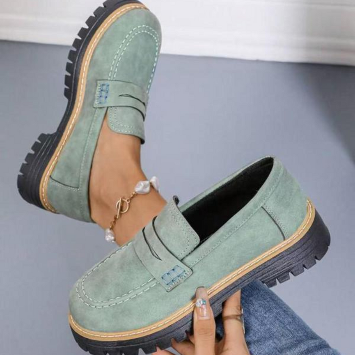 Elegant black chunky platform loafers for women, offering a comfortable and fashionable choice for office or casual outfits.