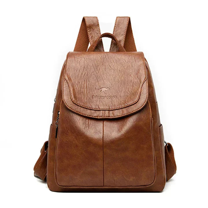 Durable structured flap backpack for women, great for work, travel, or as a stylish daily handbag.