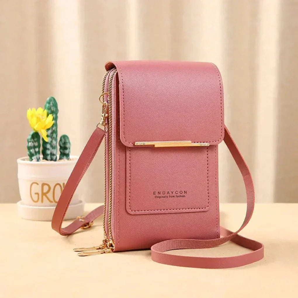 Women's crossbody bag with clear window for touchscreen phone. Secure & handy travel organizer for essentials.