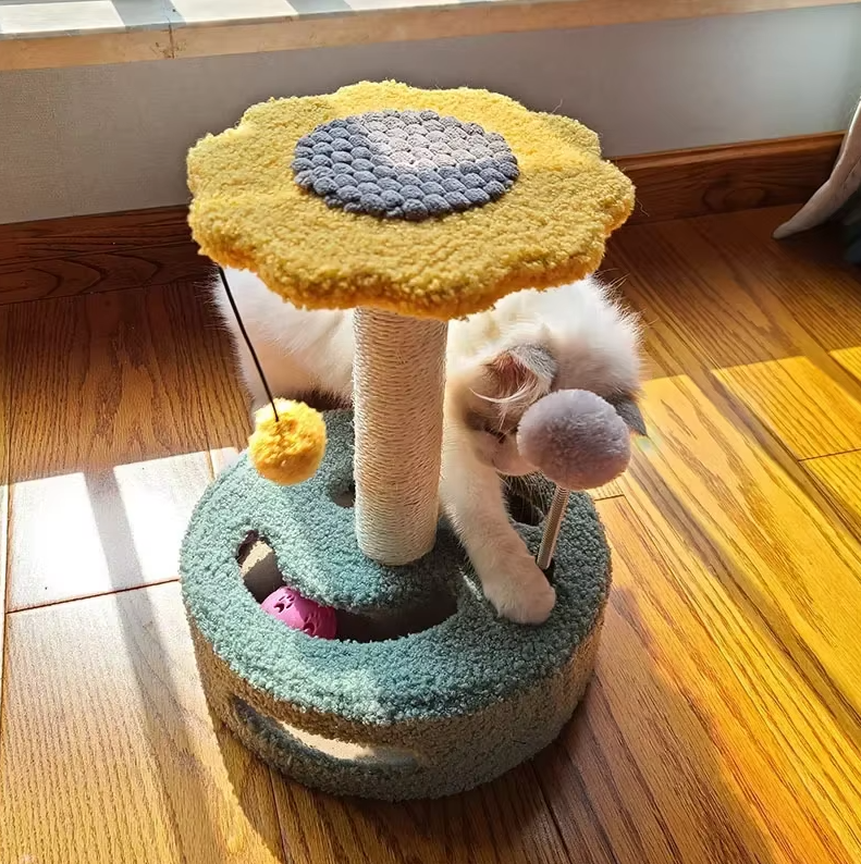 Sisal sunflower cat scratching post for active cats, featuring an attached toy for interactive play.