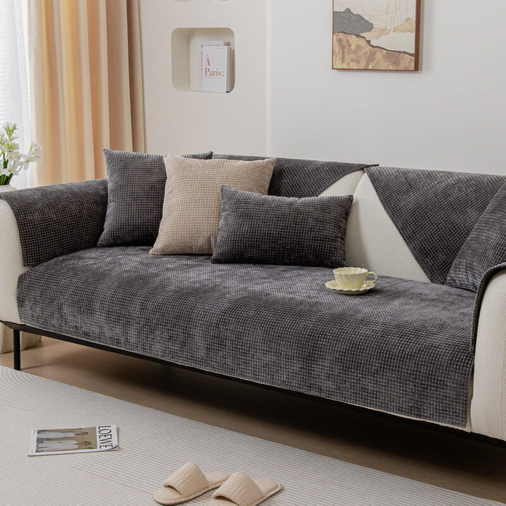 Close-up of the soft waffle knit chenille fabric on a durable furniture protector couch cover.